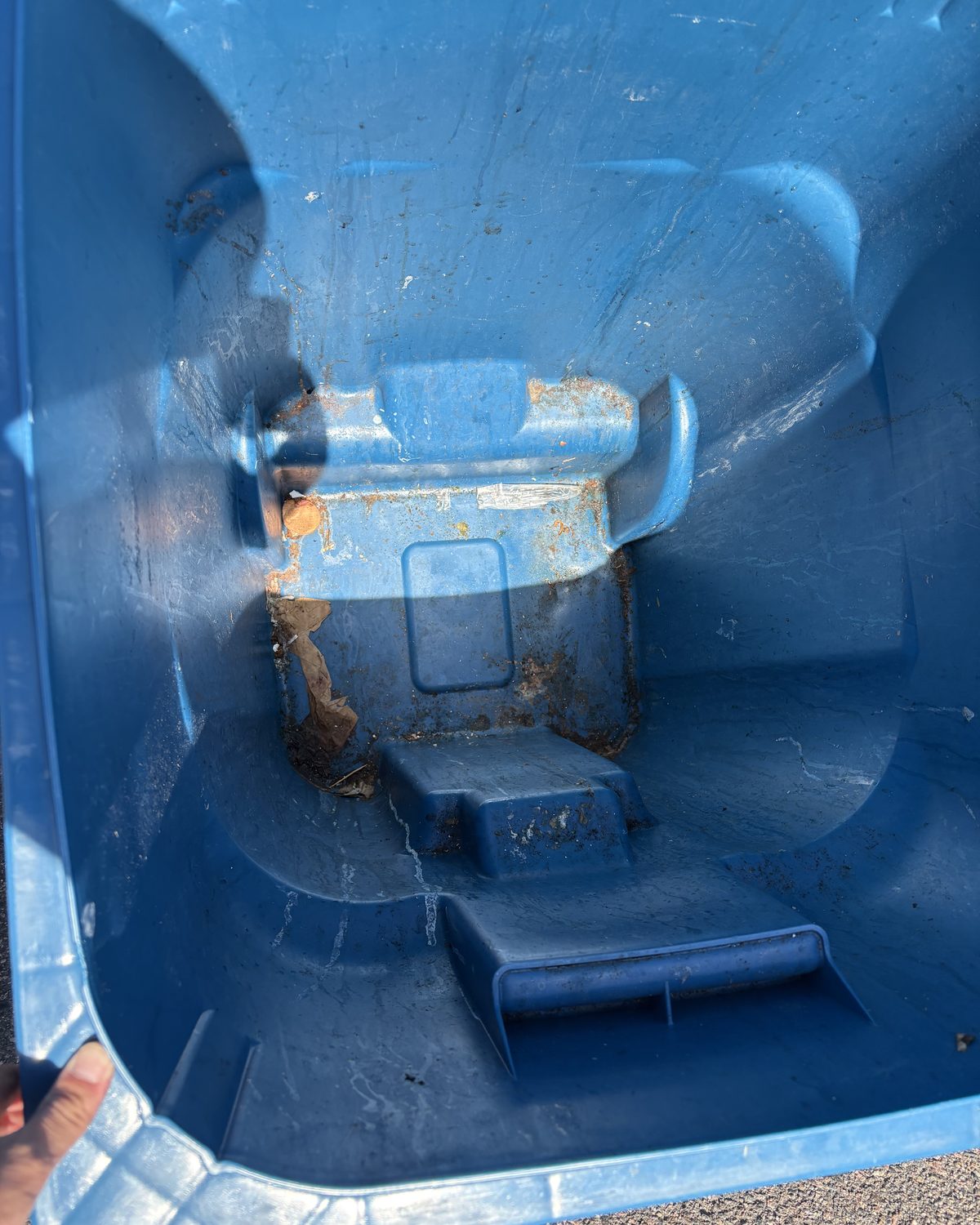 Recycling bin before Front Range cleaning, showing rust and grime