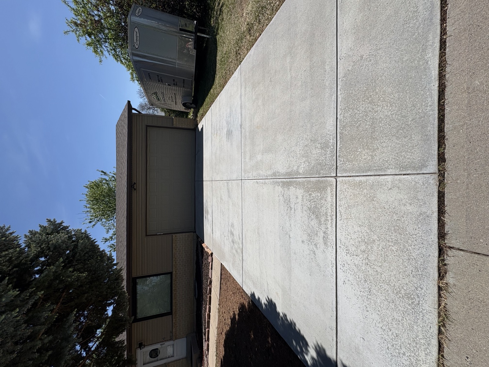 Driveway after Front Range pressure washing, fully cleaned